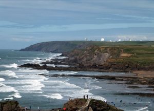 Looking north from Bude along the Atlantic coast and the satellite dishes of GCHQ Bude